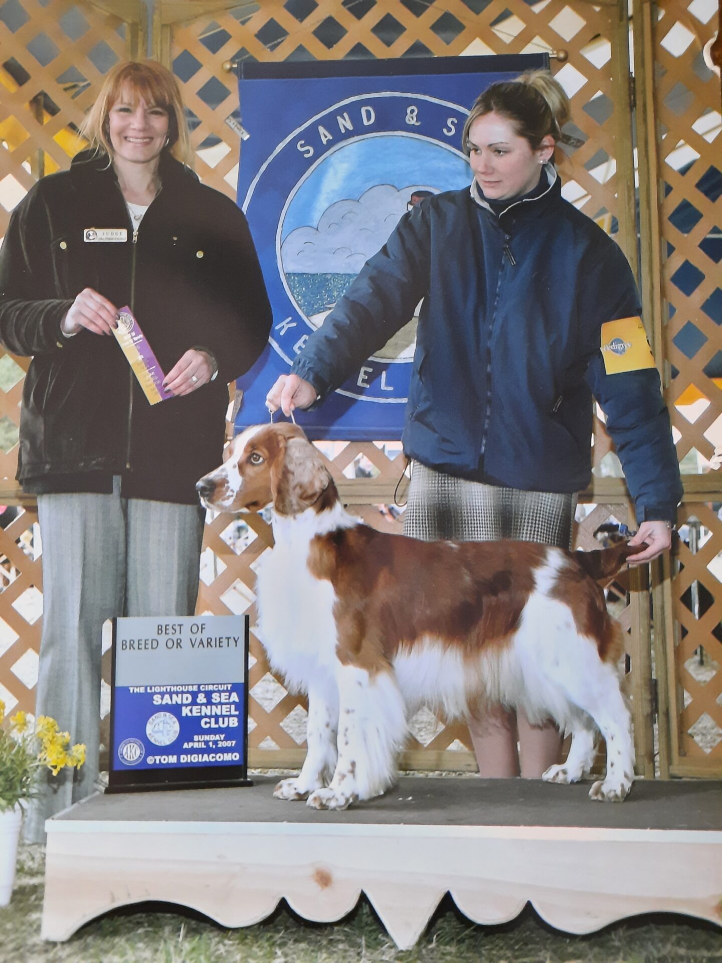 two women and a dog at a dog show